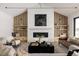 Spacious living room features a modern fireplace and built-in shelving at 3120 Braun Ct, Golden, CO 80401