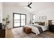 Spacious main bedroom with king bed and sliding glass doors at 3120 Braun Ct, Golden, CO 80401