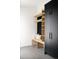 Functional mudroom with built-in bench, shelving, and coat hooks at 3120 Braun Ct, Golden, CO 80401