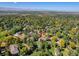 Aerial view showcasing a house nestled in a neighborhood with mountain views in the background at 1866 W Davies Ave, Littleton, CO 80120