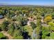 An aerial view of a charming house with a green lawn, situated in a quiet neighborhood at 1866 W Davies Ave, Littleton, CO 80120