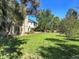 Expansive grassy backyard with mature trees and privacy at 1866 W Davies Ave, Littleton, CO 80120