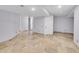 Spacious finished basement with tile flooring and neutral walls at 1866 W Davies Ave, Littleton, CO 80120