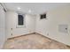 Finished basement room with two windows and tile floors at 1866 W Davies Ave, Littleton, CO 80120