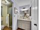 Elegant bathroom with a large vanity and a walk-in shower at 1866 W Davies Ave, Littleton, CO 80120