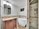 Basement bathroom with a soaking tub and walk-in shower at 1866 W Davies Ave, Littleton, CO 80120