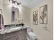 Updated bathroom with granite countertop, modern vanity, and stylish fixtures at 1866 W Davies Ave, Littleton, CO 80120