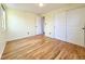 Bedroom with hardwood floors and built-in shelving at 1866 W Davies Ave, Littleton, CO 80120