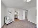 Bright bedroom with hardwood floors and double doors leading to closet at 1866 W Davies Ave, Littleton, CO 80120