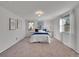 Bright bedroom with a queen-size bed and plenty of floor space at 1866 W Davies Ave, Littleton, CO 80120