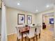 Charming dining area with hardwood floors and view into living room at 1866 W Davies Ave, Littleton, CO 80120