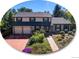 Two-story house with a brick facade, attached two-car garage, and landscaped yard at 1866 W Davies Ave, Littleton, CO 80120