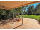 Covered patio overlooking the large backyard at 1866 W Davies Ave, Littleton, CO 80120