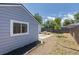 Backyard featuring nice landscaping and a table at 3570 Center Ave, Denver, CO 80219