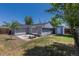 Backyard featuring nice landscaping, an outdoor table, and a shed at 3570 Center Ave, Denver, CO 80219