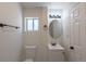 Bathroom featuring white vanity, toilet, and updated fixtures at 3570 Center Ave, Denver, CO 80219