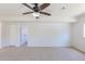 Spacious carpeted bedroom with ceiling fan and double door closet at 3570 Center Ave, Denver, CO 80219