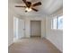 Bedroom with natural light, large closet, ceiling fan, and neutral carpet at 3570 Center Ave, Denver, CO 80219
