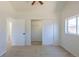 Vaulted ceiling primary bedroom with closet and a window at 3570 Center Ave, Denver, CO 80219