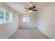 Bedroom featuring natural light, neutral carpet, and a ceiling fan at 3570 Center Ave, Denver, CO 80219