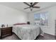 Comfortable bedroom with a ceiling fan, a window, and soft carpet at 10129 Glencoe Ct, Thornton, CO 80229