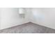 Empty bedroom with plush carpeting and a window letting in natural light at 10129 Glencoe Ct, Thornton, CO 80229