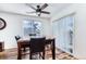 Bright dining room with a marble table and a sliding glass door that brings in natural light at 10129 Glencoe Ct, Thornton, CO 80229