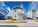 Charming two-story home featuring a well-manicured lawn, attached garage, and inviting front entrance at 10129 Glencoe Ct, Thornton, CO 80229