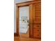 Bedroom view featuring wood closet and doorway, white bedding and hardwood floors at 1586 Steele St, Denver, CO 80206