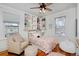 Well lit bedroom with hardwood floors and built in bookshelves for storage at 1586 Steele St, Denver, CO 80206