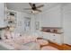 Bright bedroom featuring built-ins, a ceiling fan and light hardwood flooring at 1586 Steele St, Denver, CO 80206