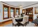 Beautiful dining room featuring stained glass windows, original wood trim and a vintage built-in at 1586 Steele St, Denver, CO 80206