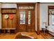 Inviting entryway with decorative wood door and trim, offering a view of the interior at 1586 Steele St, Denver, CO 80206