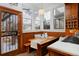 Eat-in kitchen with custom wood paneling and charming built-in bench seating at 1586 Steele St, Denver, CO 80206