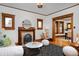 Open living room showcasing a decorative fireplace, hardwood floors, and seamless flow to the dining area at 1586 Steele St, Denver, CO 80206