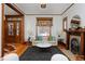 Cozy living room with hardwood floors, decorative fireplace, and abundant natural light at 1586 Steele St, Denver, CO 80206