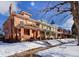 Charming brick homes line a snow covered street at 1586 Steele St, Denver, CO 80206