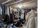 Basement storage area with clothes and other personal items at 155 Paris Cir, Aurora, CO 80011