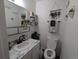 Tastefully decorated half-bath with stylish accents, vanity, and fixtures at 155 Paris Cir, Aurora, CO 80011