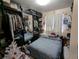 Bedroom with wardrobe and mirrored doors, complemented by sports decorations at 155 Paris Cir, Aurora, CO 80011