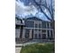 Charming townhome featuring a classic brick facade and muted blue siding at 155 Paris Cir, Aurora, CO 80011