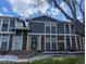Charming townhome featuring a well-maintained exterior with brick accents and a welcoming front entrance at 155 Paris Cir, Aurora, CO 80011