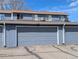 Attached garages offer convenience and ample parking space in this well-kept townhome community at 155 Paris Cir, Aurora, CO 80011