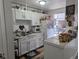 Functional kitchen with white cabinets, and wood-look flooring at 155 Paris Cir, Aurora, CO 80011