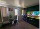 Cozy living area with neutral tones, bright light, and a view of the home's entrance at 155 Paris Cir, Aurora, CO 80011