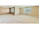 Bright and airy bedroom with neutral carpet and two large windows with plantation shutters at 6731 S Kearney Ct, Centennial, CO 80112
