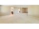 Spacious bedroom with neutral carpet, ceiling fan, and access to ensuite bathroom at 6731 S Kearney Ct, Centennial, CO 80112
