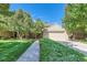 Charming home featuring mature trees, a well-manicured lawn, and a welcoming two-car garage at 6731 S Kearney Ct, Centennial, CO 80112