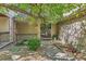 Inviting front porch with brick accents, decorative railings, and a stylish front door with metal security screen at 6731 S Kearney Ct, Centennial, CO 80112