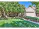 Charming home with well-manicured lawn and inviting curb appeal under a mature tree canopy at 6731 S Kearney Ct, Centennial, CO 80112